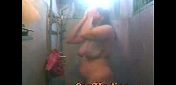  993451 thick indian slut wife films herself bathing